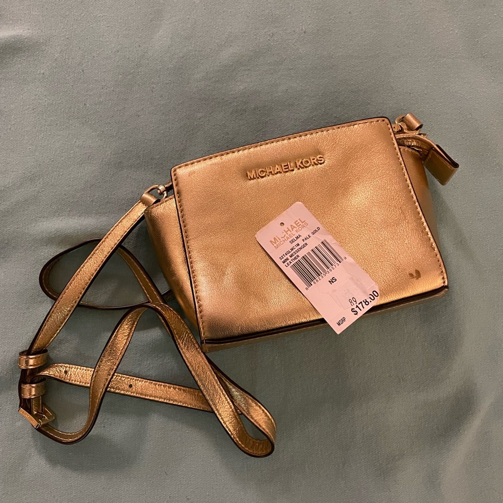 Michael Kors Selma mini messenger leather crossbody in metallic/shiny gold